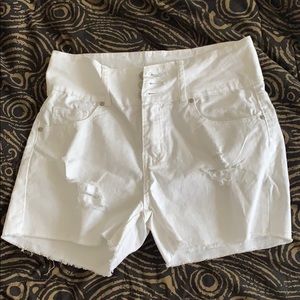 White ripped shorts